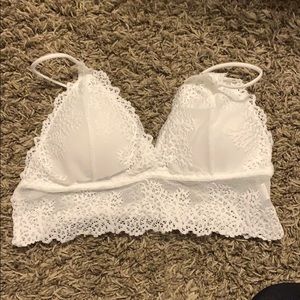 Two very cute pink and white lace bralettes